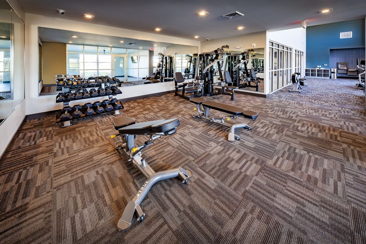 Fitness center with free weights and strength equipment
